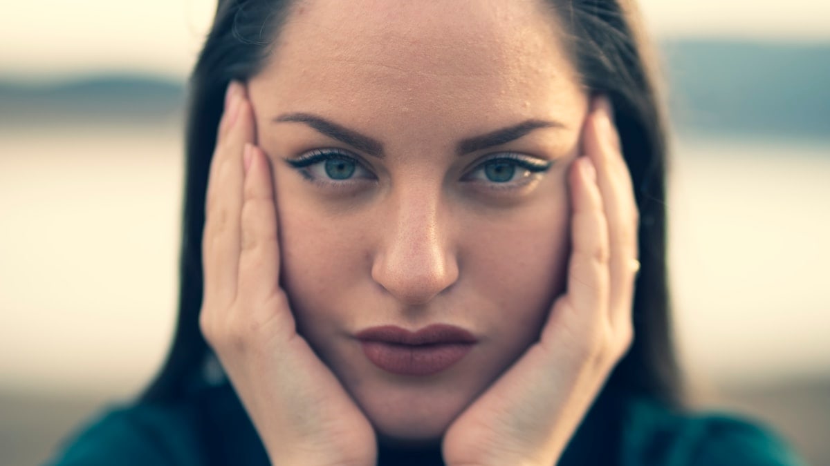 focus photography of woman's face